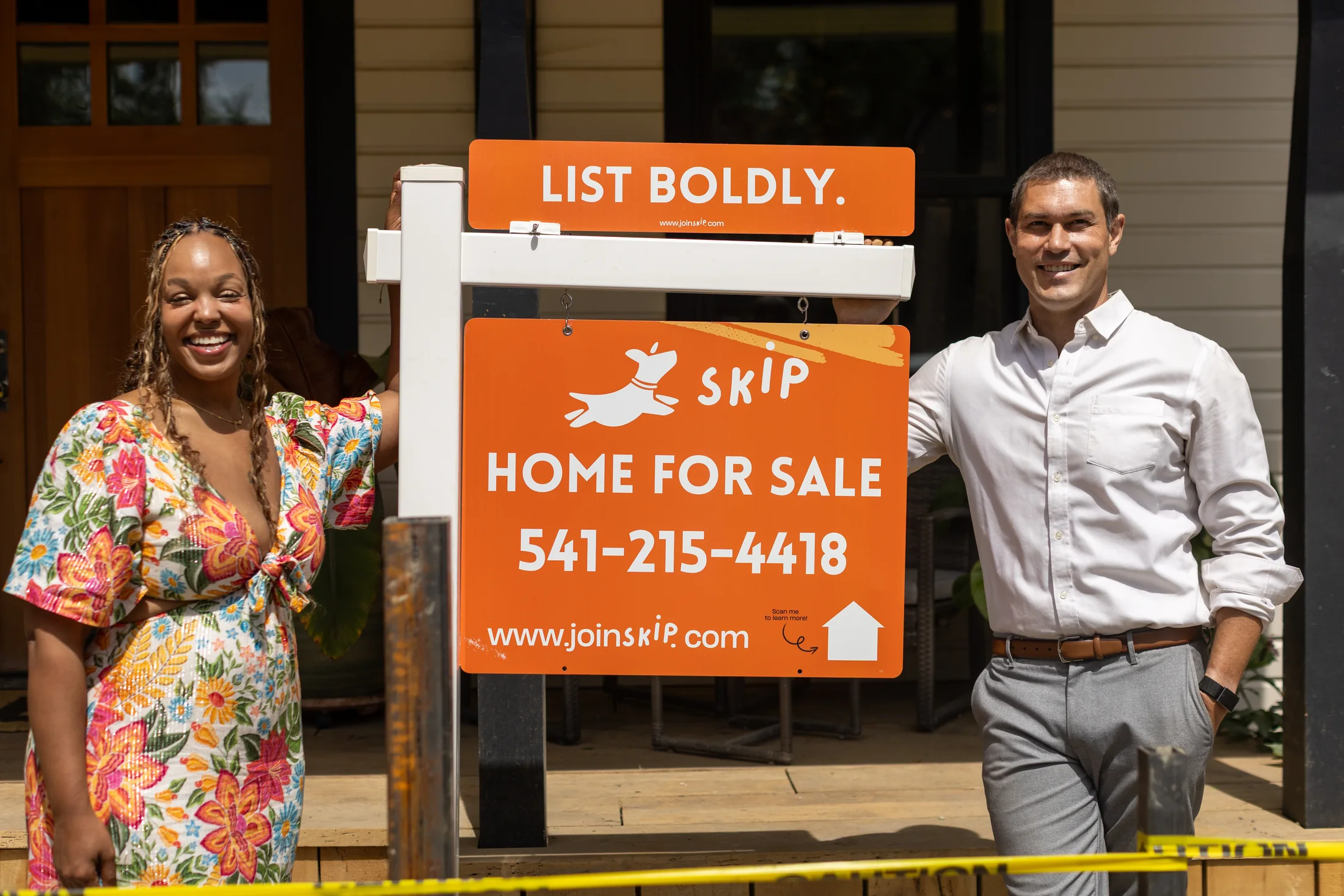 Skip Real Estate agents beside a home for sale in Southern Oregon